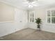 Neutral bedroom with beadboard, double closets, ceiling fan and plantation shutters at 113 Preston Pines Dr, Cary, NC 27513