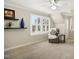 Carpeted bonus room with vaulted ceilings, seating and plantation shutters at 113 Preston Pines Dr, Cary, NC 27513