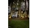 Beautiful two-story home with lush landscaping and lovely lighting enhancing the curb appeal at 113 Preston Pines Dr, Cary, NC 27513
