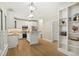 Bright kitchen featuring white cabinets, stainless steel appliances, and a center island at 113 Preston Pines Dr, Cary, NC 27513