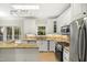 Bright and functional kitchen featuring stainless appliances, custom cabinets, and natural lighting at 113 Preston Pines Dr, Cary, NC 27513