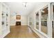 Spacious living room with hardwood floors, fireplace and large windows providing natural light at 113 Preston Pines Dr, Cary, NC 27513