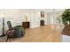 Open living room with fireplace, hardwood floors, and natural light at 113 Preston Pines Dr, Cary, NC 27513
