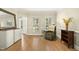Comfortable sitting room featuring hardwood floors and plantation shuttered windows at 113 Preston Pines Dr, Cary, NC 27513