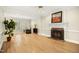 Bright living room featuring hardwood floors, fireplace, and detailed trim at 113 Preston Pines Dr, Cary, NC 27513