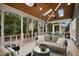 Inviting screened porch with skylights, fan, and ample seating, perfect for relaxing and entertaining at 113 Preston Pines Dr, Cary, NC 27513