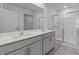 Modern bathroom features double sinks, a large mirror, and a sleek glass-enclosed shower at 117 Pisgah St, Sanford, NC 27330