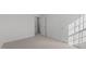 Neutral bedroom showcasing a closet and fresh paint and carpet creating an inviting space to relax and unwind at 117 Pisgah St, Sanford, NC 27330