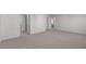 Spacious bedroom featuring neutral carpeting, multiple closets, and easy access to adjacent rooms at 117 Pisgah St, Sanford, NC 27330