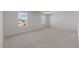 Large, bright bedroom with neutral carpet and natural light from large windows, offering a serene space at 117 Pisgah St, Sanford, NC 27330