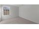 Bedroom featuring neutral carpet, fresh paint, and a closet at 117 Pisgah St, Sanford, NC 27330