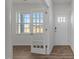 Bright foyer featuring a window, decorative french door, and a classic paneled front door at 117 Pisgah St, Sanford, NC 27330