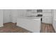 Open kitchen featuring an island with granite countertops, stainless steel appliances, and ample storage at 117 Pisgah St, Sanford, NC 27330