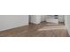 Bright living room with stylish wood flooring offering plenty of natural light and an open floor plan at 117 Pisgah St, Sanford, NC 27330