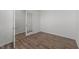 View of a well-lit office space showcasing wood flooring and a glass paneled door at 117 Pisgah St, Sanford, NC 27330