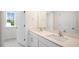 Bright bathroom featuring a double vanity, large mirror and window offering natural light at 120 Pisgah St, Sanford, NC 27330