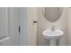 Bathroom featuring modern fixtures, toilet, sink and a framed mirror at 120 Pisgah St, Sanford, NC 27330