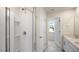 Clean, new bathroom featuring a shower with glass door, vanity and a linen closet at 120 Pisgah St, Sanford, NC 27330