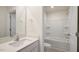 Well lit bathroom featuring vanity with granite counters, tile floor and tub at 120 Pisgah St, Sanford, NC 27330