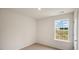 An empty secondary bedroom with carpeted floors and natural light at 120 Pisgah St, Sanford, NC 27330