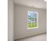 Bright bedroom featuring a window, neutral walls and carpet at 120 Pisgah St, Sanford, NC 27330
