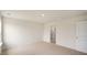 An empty bedroom featuring plush carpeting, and view to an ensuite bath at 120 Pisgah St, Sanford, NC 27330