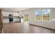 Modern kitchen with white cabinets, stainless steel appliances, and sliding glass door to the backyard at 120 Pisgah St, Sanford, NC 27330
