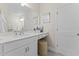 Bathroom featuring vanity with ample counter space, a well-lit mirror, and vanity stool at 1257 S Blount Street # 201, Raleigh, NC 27601