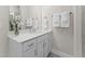 Bathroom vanity area with a sink, white cabinetry, and modern fixtures at 1257 S Blount Street # 201, Raleigh, NC 27601