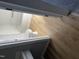 Neat bathroom showcasing white fixtures, bathtub, and vinyl floors at 128 Glengariff Ln, Clayton, NC 27520