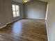 Spacious living room with vinyl floors, natural light, and open layout at 128 Glengariff Ln, Clayton, NC 27520