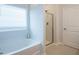 Bright bathroom with a separate tub and shower, featuring modern tile flooring at 131 E Victory View. Ter, Smithfield, NC 27577