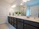 Elegant bathroom features a double vanity, ample storage, and modern fixtures at 131 E Victory View. Ter, Smithfield, NC 27577