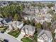 Aerial view showcasing the home's manicured lawn, mature trees, and desirable neighborhood at 13121 Sargas St, Raleigh, NC 27614