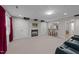 Finished basement with a cozy fireplace, built-in cabinets, and a wet bar, perfect for entertaining at 13121 Sargas St, Raleigh, NC 27614