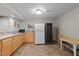 Finished basement featuring a wet bar, sink, full-sized refrigerator, and a wine cooler at 13121 Sargas St, Raleigh, NC 27614