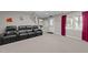 Finished basement offering a cozy theater area with comfortable seating and natural light from a window at 13121 Sargas St, Raleigh, NC 27614