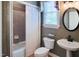 Bathroom featuring a shower and tub combination, pedestal sink and toilet at 13121 Sargas St, Raleigh, NC 27614