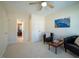Cozy bedroom with a ceiling fan and two chairs flanking a chessboard table at 13121 Sargas St, Raleigh, NC 27614
