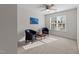 Bedroom with lots of natural light, featuring two cozy armchairs and a game table at 13121 Sargas St, Raleigh, NC 27614