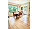 Cozy breakfast nook with large windows offering a view of the backyard and modern light fixture at 13121 Sargas St, Raleigh, NC 27614