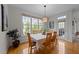 Cozy dining area featuring hardwood floors, natural light, and a view of the backyard at 13121 Sargas St, Raleigh, NC 27614
