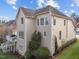 Back exterior of a home showcasing a deck, patio, and well-maintained yard at 13121 Sargas St, Raleigh, NC 27614