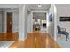 Hallway with hardwood floors providing access to multiple rooms and living spaces at 13121 Sargas St, Raleigh, NC 27614