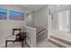 Hallway with chair, artwork and view to another bedroom at 13121 Sargas St, Raleigh, NC 27614