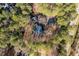 An aerial view of the home situated within a lush green forest at 1617 Jenkins Rd, Wake Forest, NC 27587