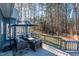 Spacious back deck offering outdoor seating, lush green surroundings, and a clear view of the backyard at 1617 Jenkins Rd, Wake Forest, NC 27587