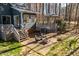 A beautiful backyard featuring a gazebo, seating, and brick patio with a fire pit, perfect for outdoor gatherings at 1617 Jenkins Rd, Wake Forest, NC 27587