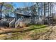 Expansive backyard featuring a deck, gazebo, patio, and lush greenery at 1617 Jenkins Rd, Wake Forest, NC 27587