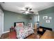 Comfortable bedroom featuring a ceiling fan, a window, and a twin bed with fun patterns and mountain-themed decor at 1617 Jenkins Rd, Wake Forest, NC 27587